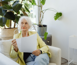 Elderly lady learning how reverse mortgage rates work